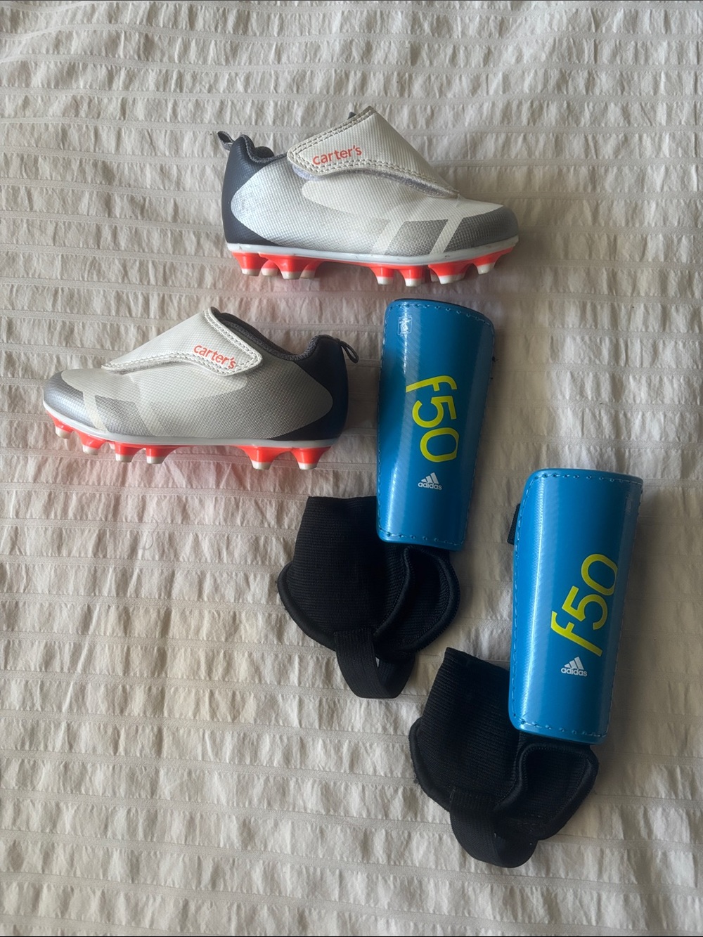 Toddler Kids Soccer Cleats in White and Gray with Blue Adidas Shinguards